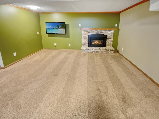 unfurnished living room featuring a textured ceiling, crown molding, carpet floors, and a fireplace