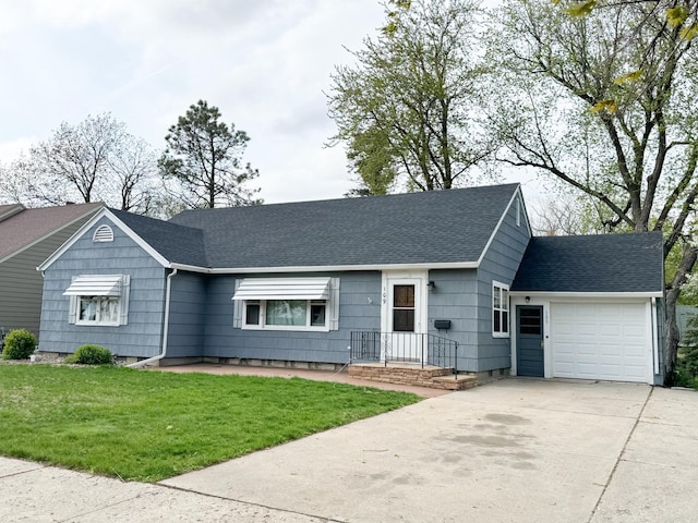 ranch-style home featuring a garage and a front yard