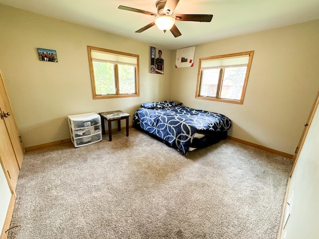 carpeted bedroom with ceiling fan