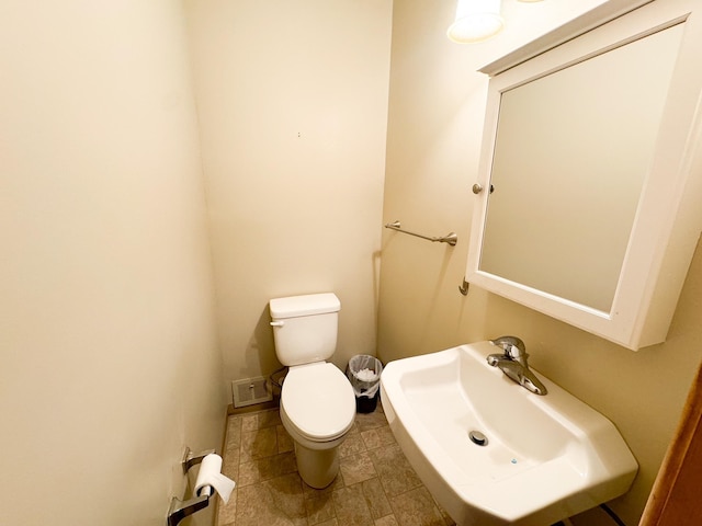 bathroom featuring sink and toilet