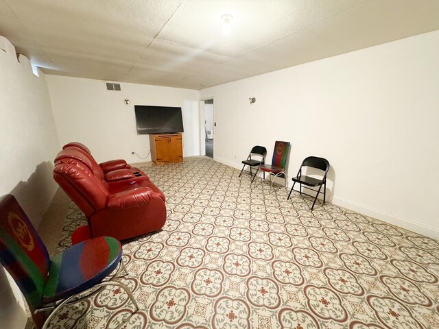 living room featuring a textured ceiling