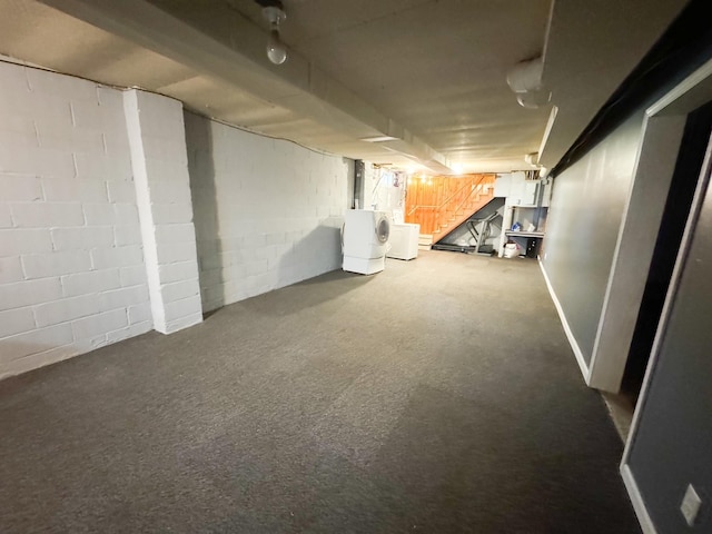 basement with washer and dryer and carpet flooring