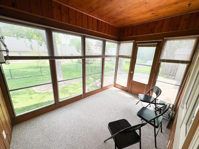 sunroom featuring wood ceiling