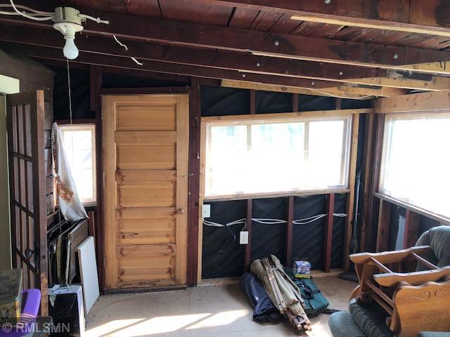 miscellaneous room featuring wooden ceiling, a healthy amount of sunlight, and lofted ceiling