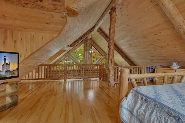 bedroom with wood ceiling, vaulted ceiling, and light wood-type flooring