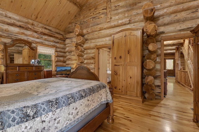 bedroom featuring rustic walls, light hardwood / wood-style flooring, and wooden ceiling