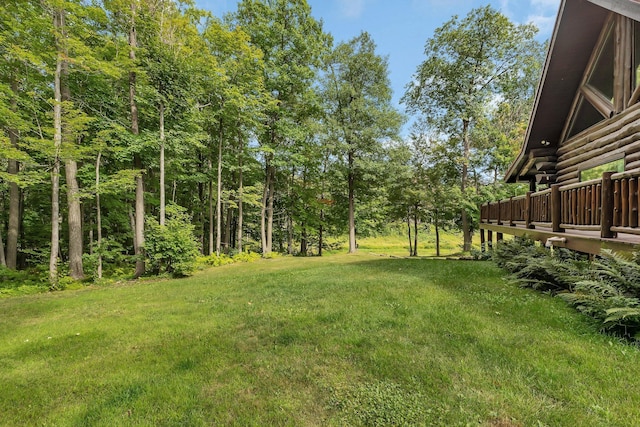 view of yard with a wooden deck