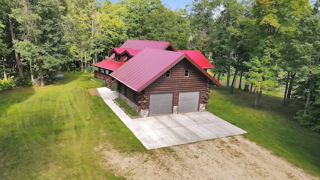 exterior space featuring a front yard and a garage