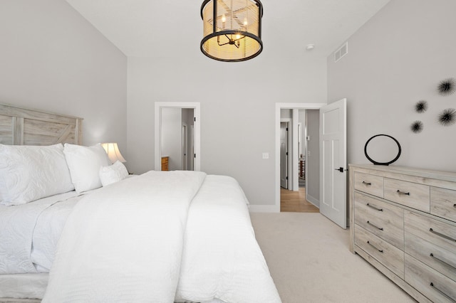 carpeted bedroom featuring a towering ceiling