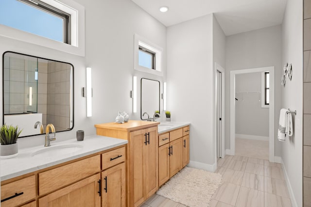 bathroom featuring tile flooring and vanity