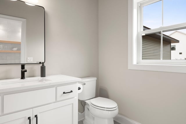 bathroom with toilet and vanity