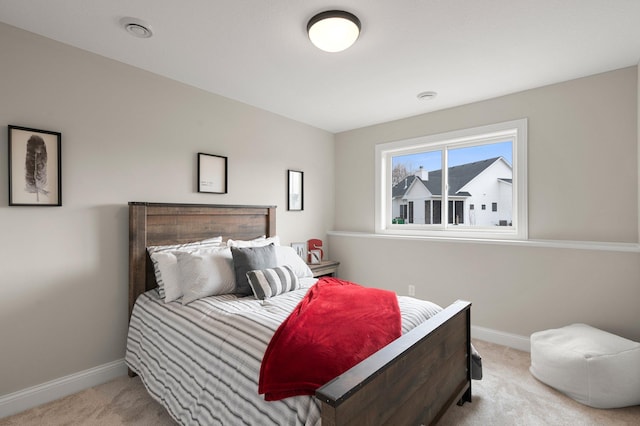 bedroom with light carpet