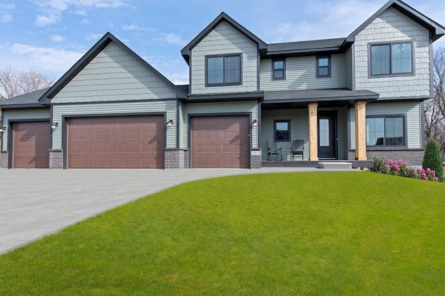 craftsman house with covered porch, a garage, and a front yard