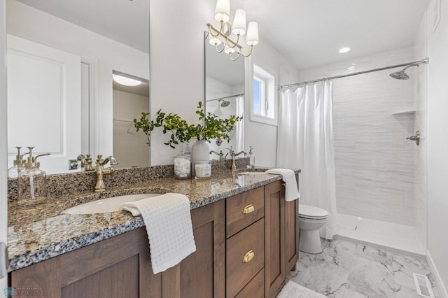 bathroom with vanity, toilet, and a shower with shower curtain