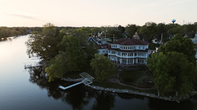 aerial view at dusk with a water view