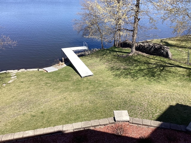 view of yard featuring a boat dock and a water view