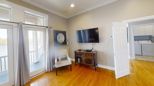 interior space featuring light hardwood / wood-style flooring, independent washer and dryer, and ornamental molding