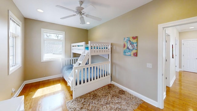 bedroom with hardwood / wood-style floors and ceiling fan