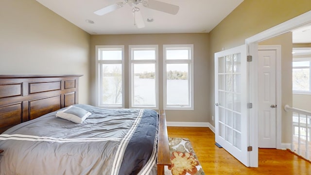 bedroom featuring ceiling fan and light hardwood / wood-style flooring