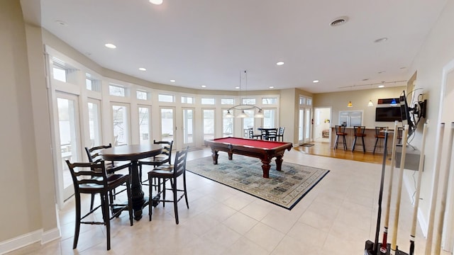 game room with light hardwood / wood-style floors and pool table