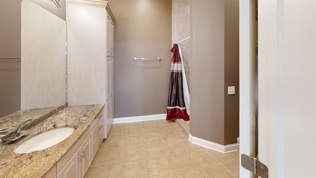 bathroom with vanity and tile patterned flooring