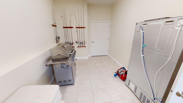 miscellaneous room featuring light tile patterned floors