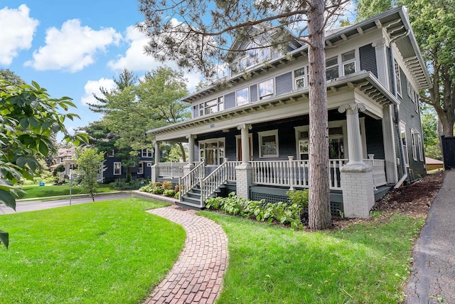 view of front of home featuring a front lawn and covered porch