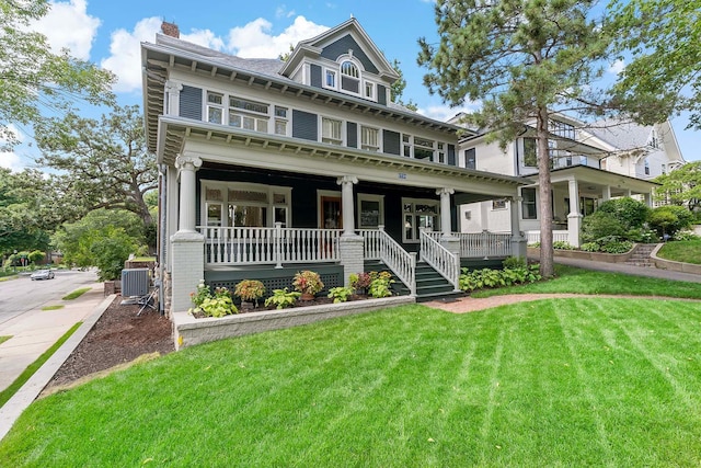 view of front of house with a front lawn and a porch