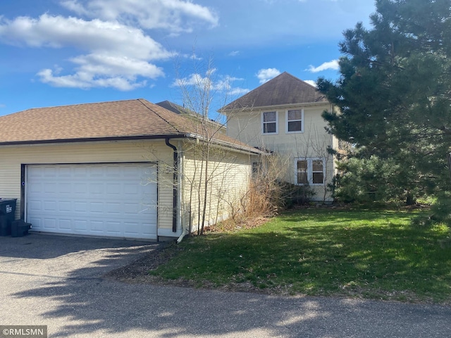 view of home's exterior with a lawn