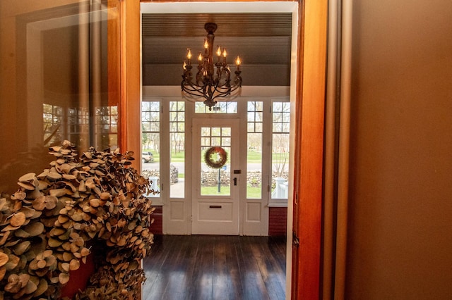 entryway featuring wooden ceiling, dark hardwood / wood-style flooring, and a notable chandelier