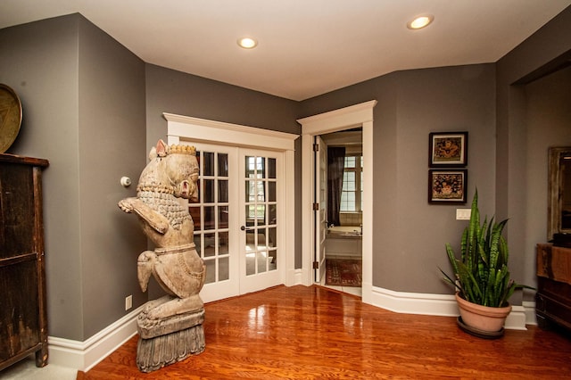 sitting room with french doors and wood-type flooring