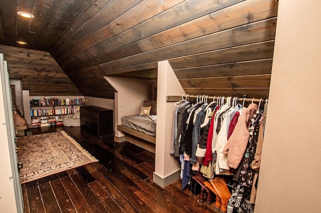 interior space with lofted ceiling and dark wood-type flooring