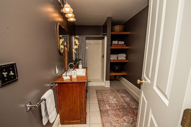 bathroom featuring tile patterned flooring, a shower with curtain, and vanity