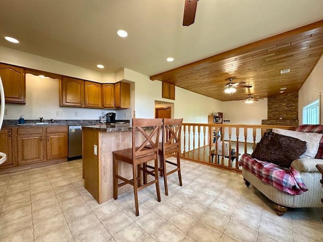 kitchen with a breakfast bar, a kitchen island, ceiling fan, wooden ceiling, and stainless steel dishwasher