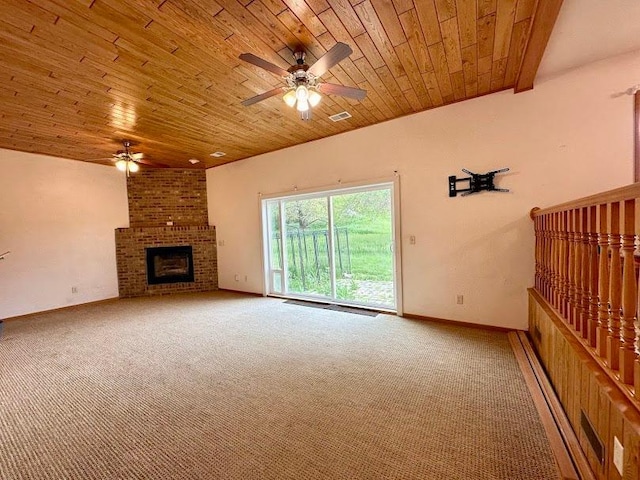 unfurnished living room with a brick fireplace, ceiling fan, wooden ceiling, and carpet flooring