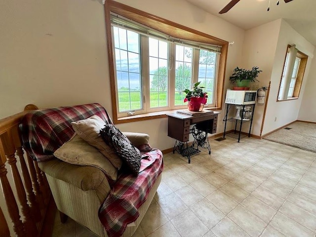 living room featuring ceiling fan