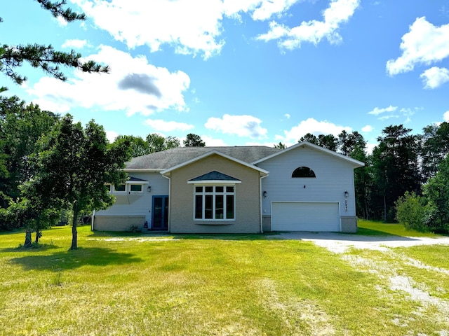 ranch-style house featuring brick siding, a front lawn, an attached garage, and dirt driveway