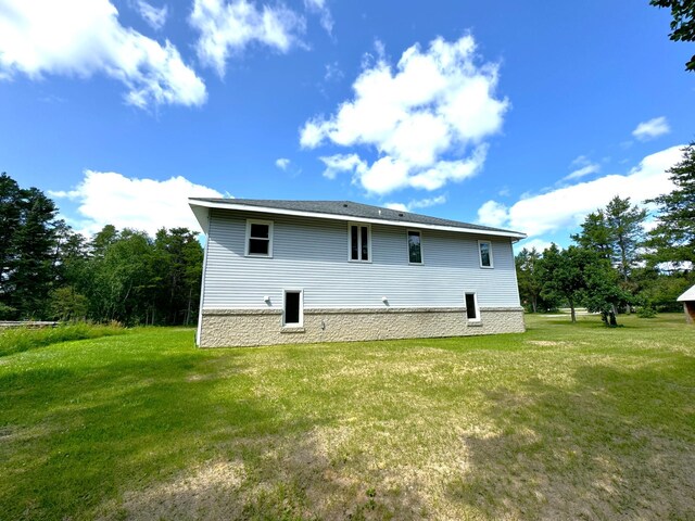 back of property with a yard