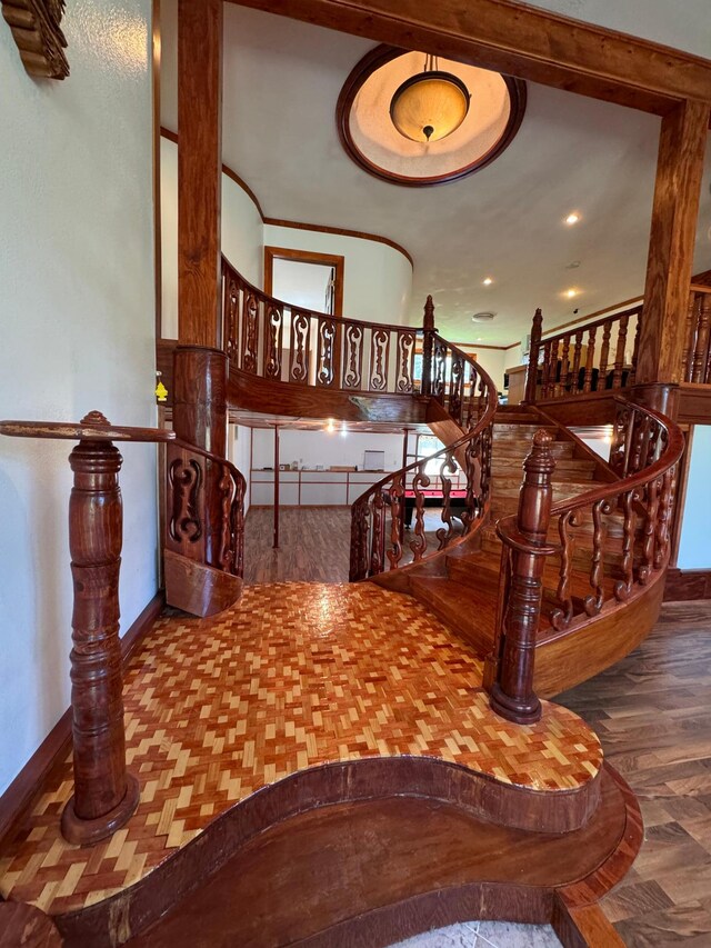 stairs with hardwood / wood-style floors