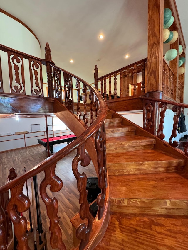 stairway featuring recessed lighting and wood finished floors