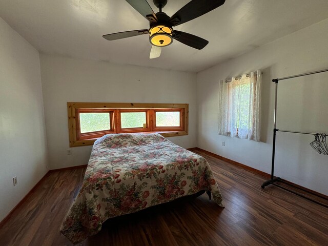 bedroom with hardwood / wood-style flooring and ceiling fan