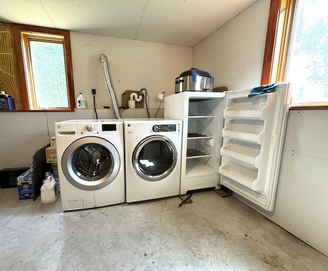 laundry room featuring washing machine and clothes dryer and laundry area