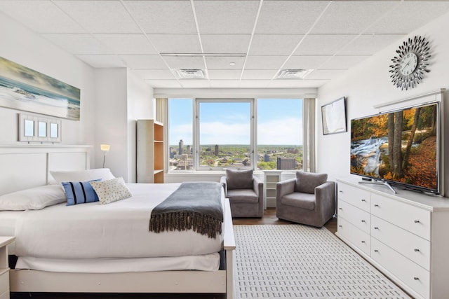 bedroom featuring a drop ceiling