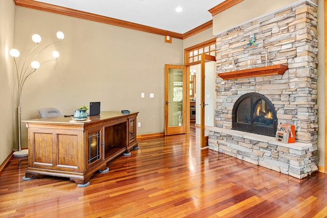 home office with hardwood / wood-style flooring, a fireplace, and ornamental molding