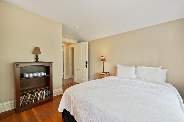 2799 27th St Unit 14, Gardeners, Birchwood, WI 54817 - bedroom with wood finished floors, baseboards, and vaulted ceiling