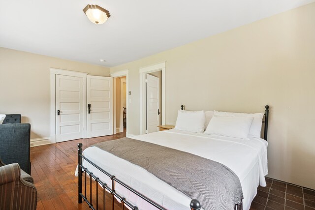 2799 27th St Unit 14, Gardeners, Birchwood, WI 54817 - bedroom with dark wood finished floors and baseboards