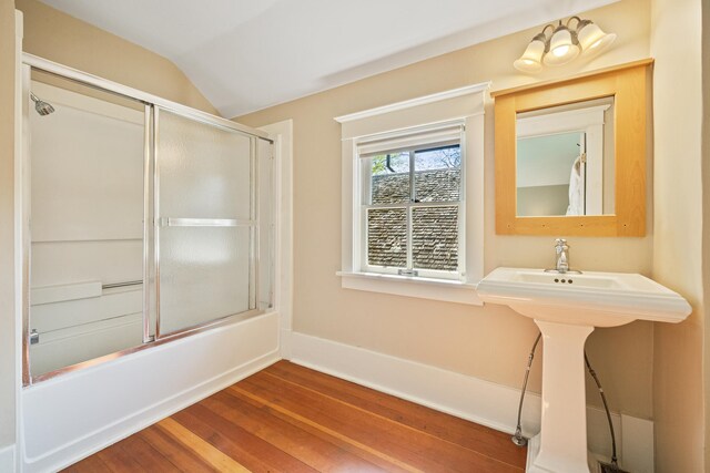 2799 27th St Unit 14, Gardeners, Birchwood, WI 54817 - full bathroom with wood finished floors, bath / shower combo with glass door, and lofted ceiling
