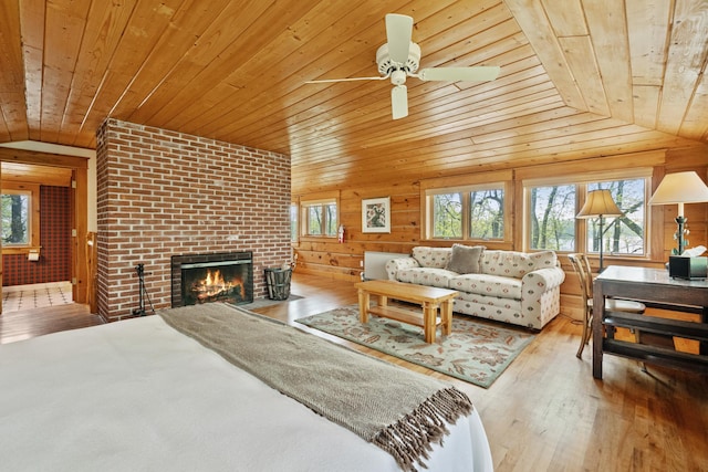 2799 27th St Unit 8, Katherine, Birchwood, WI 54817 - bedroom featuring wood ceiling, lofted ceiling, a fireplace, wood-type flooring, and wooden walls