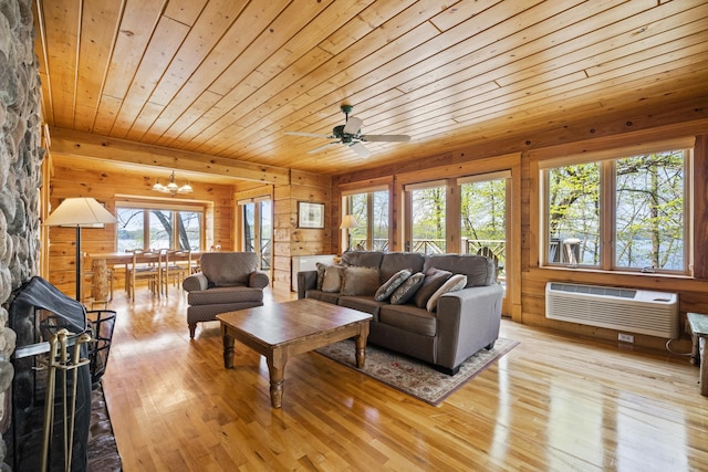 2799 27th St Unit 8, Katherine, Birchwood, WI 54817 - living room with a wall mounted air conditioner, wooden ceiling, plenty of natural light, light wood-style flooring, and wooden walls