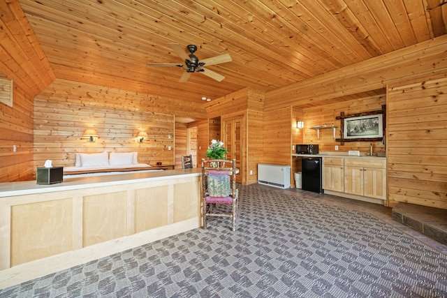 2799 27th St Unit 9 Douglas 1, Birchwood, WI 54817 - kitchen with refrigerator, wooden walls, wooden ceiling, ceiling fan, and light brown cabinets